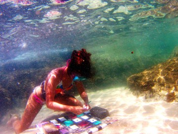 A French Artist Orianne Sophie Kukukita painting under the sea